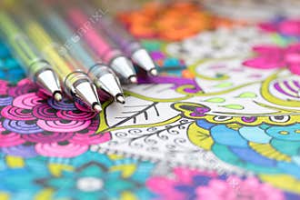 Adult coloring book, new stress relieving trend. Art therapy, mental health, creativity and mindfulness concept.