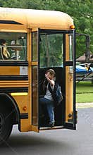 Boy Waving getting on Bus