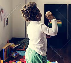 Black kid throwing baseball ball