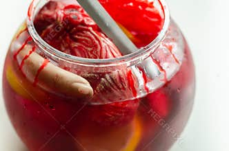 Punch prepared for Halloween party with decorative elements stylized as human organs