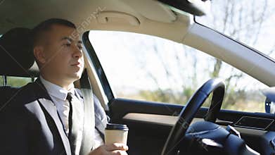 Confident business man experience to riding an autonomous self driving car. Relaxed man experience to riding an