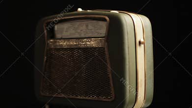 Vintage Radio Transistor From 1960s, Old Portable Device Spinning on Black