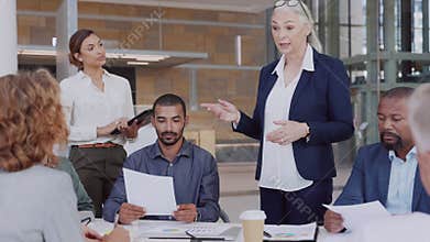 Multiethnic business team in meeting at modern board room