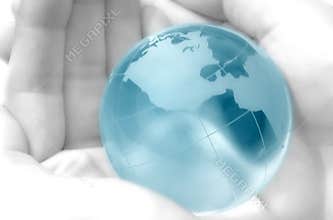 Hand holding globe
