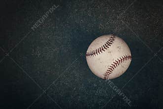 Close up one baseball ball on dark background