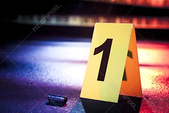 Fresh crime scene with yellow tape at night