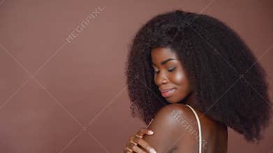 Seductive happy young afro american girl. Skincare concept. Closeup portrait.