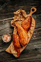 Hot smoked river bass fish on wooden cutting board. vertical image. top view. place for text