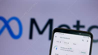 The new company name is Facebook Meta logo. The Facebook application from Meta is installed on the smartphone screen. Meta company
