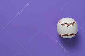 Baseball on purple table background, top view sport concept