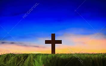 Cross silhouette with sunset background
