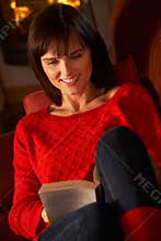 Middle Aged Woman Relaxing With Book