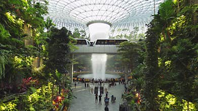 Asian people or tourist traveler at indoor waterfall, Jewel Changi International Airport