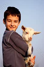 A boy with baby goat
