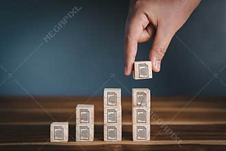 Database Documentation Files Management Trend Concept, Hand is Putting Wooden Cube With File Icon Stacking Storage. Strategy Plan
