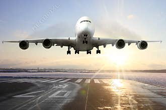 Passenger airplane landing on runway in airport.