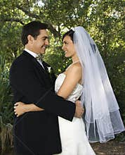 Bride and groom embracing.