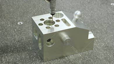 Operator inspection dimension metal parts by CMM after machining process in industrial factory