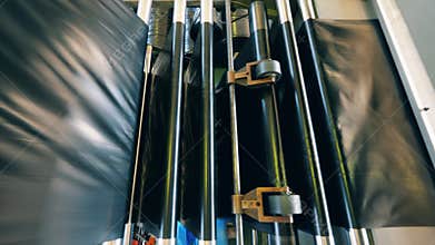 Black plastic bag manufacturing machine. Top view