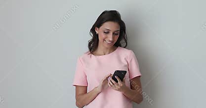 Attractive arab indian woman using smartphone applications.