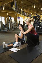 Adult female with personal trainer.