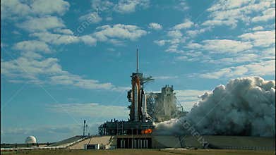 The Space Shuttle lifts off from the launch pad. Shuttle engine closeup.