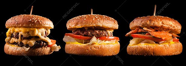 Burgers set isolated on black background. Hamburger, cheeseburger and fish burger for the restaurant menu