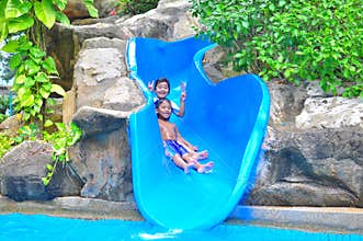 A girl ond a boy a slide