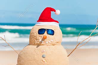 Snowman Made Out Of Sand With Santa Hat