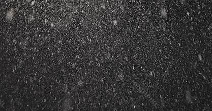 Falling snow at night