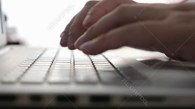 Close up of person hand typing on laptop keyboard, author writing on pc computer, businessman programmer working