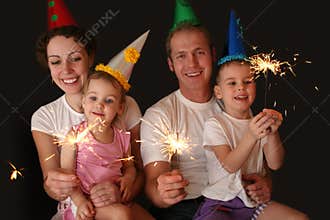 Family of four with sparklers