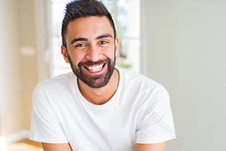 Handsome man smiling cheerful with a big smile on face showing teeth, positive and happy expression