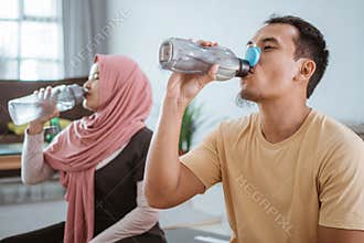 Asian fitness couple, man and woman exercising together at home