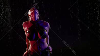 sexuality and femininity of young woman dancing arabic dance under rain, lady with big breasts