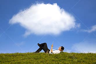 Happy businessman working with tablet pc