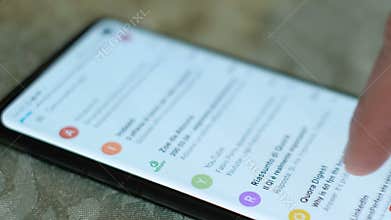 Man hand while using a smartphone google gmail app,email surfing,business news