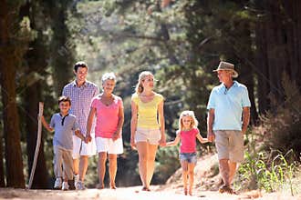 3 Generation family walking along country road