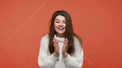 Bemused overwhelmed brunette woman looking at camera with astonishment