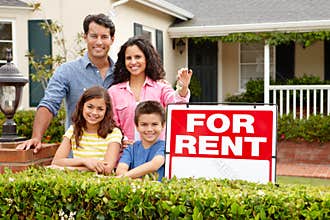 Hispanic family outside home for rent