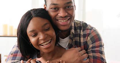 Loving couple embracing at home