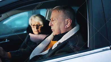 Elderly couple witnessing crime scene in their car. Traffic accident. flashing police lights