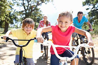 Young family on country bike ride