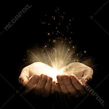 Open hands with glowing lights