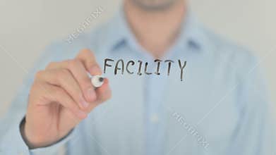 Facility Management, Man Writing on Transparent Screen