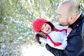 Winter Time Father and Daughter Kissing