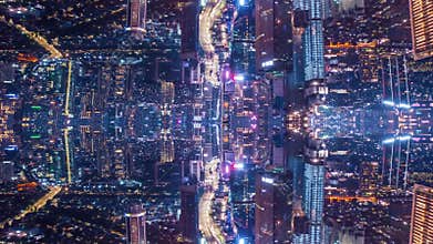 Abstract hyperlapse shot of modern city at night. Illuminated buildings and streams of light in streets. Futuristic
