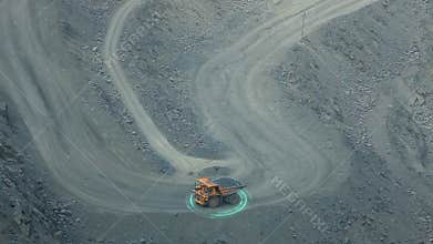 A mining dump truck drives on a road in a deep iron ore quarry. Iron ore mining. Visualization of a modern quarry.
