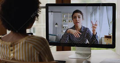 Two diverse young ladies having online conversation in messenger app