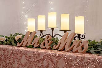 Closeup of a Mr & Mrs sign on a table at a wedding
